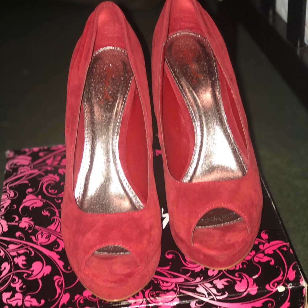 Red suede pumps